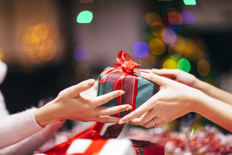 Hands Giving Gift Close-up