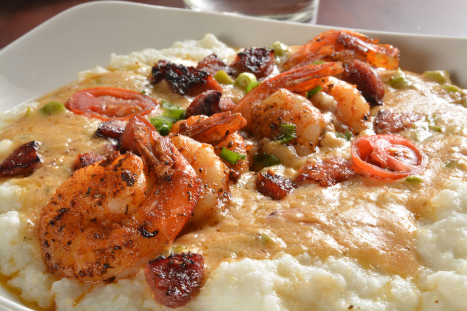 Cajun shrimp on a bowl of grits