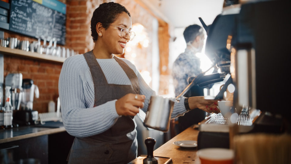 female barista working in coffee shop