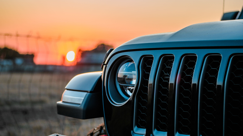 A closeup shot of Jeep Gladiator against a sunset